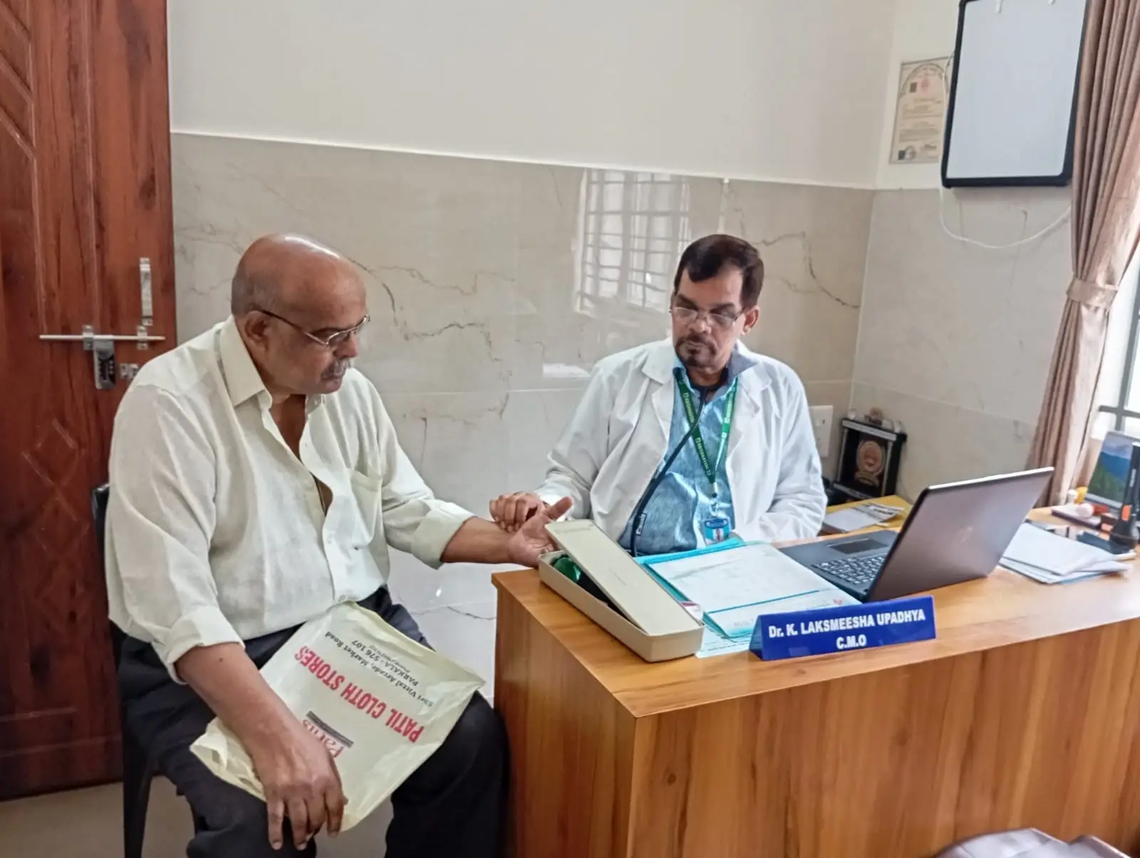Patient consultation with Dr. K. Lakshmeesha Upadhya